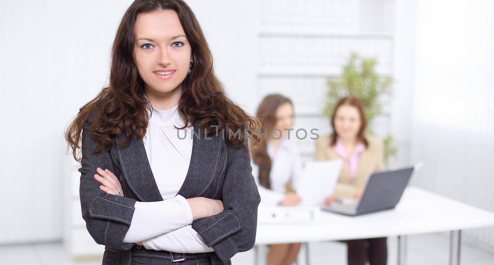 closeup.smiling business woman on the background of the office by SmartPhotoLab