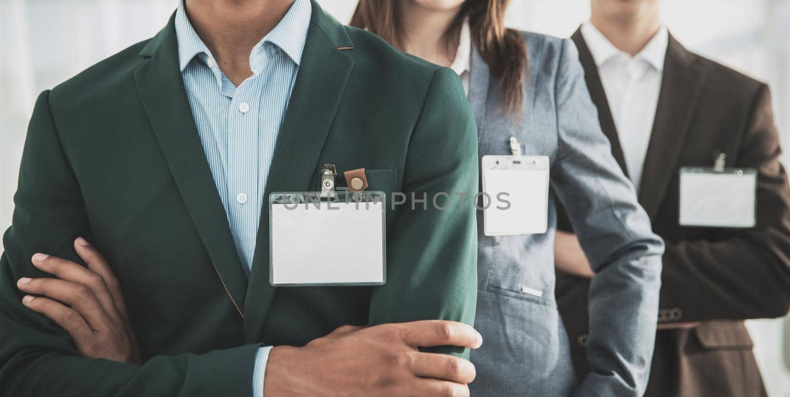 closeup.group of business people with blank badges.business concept