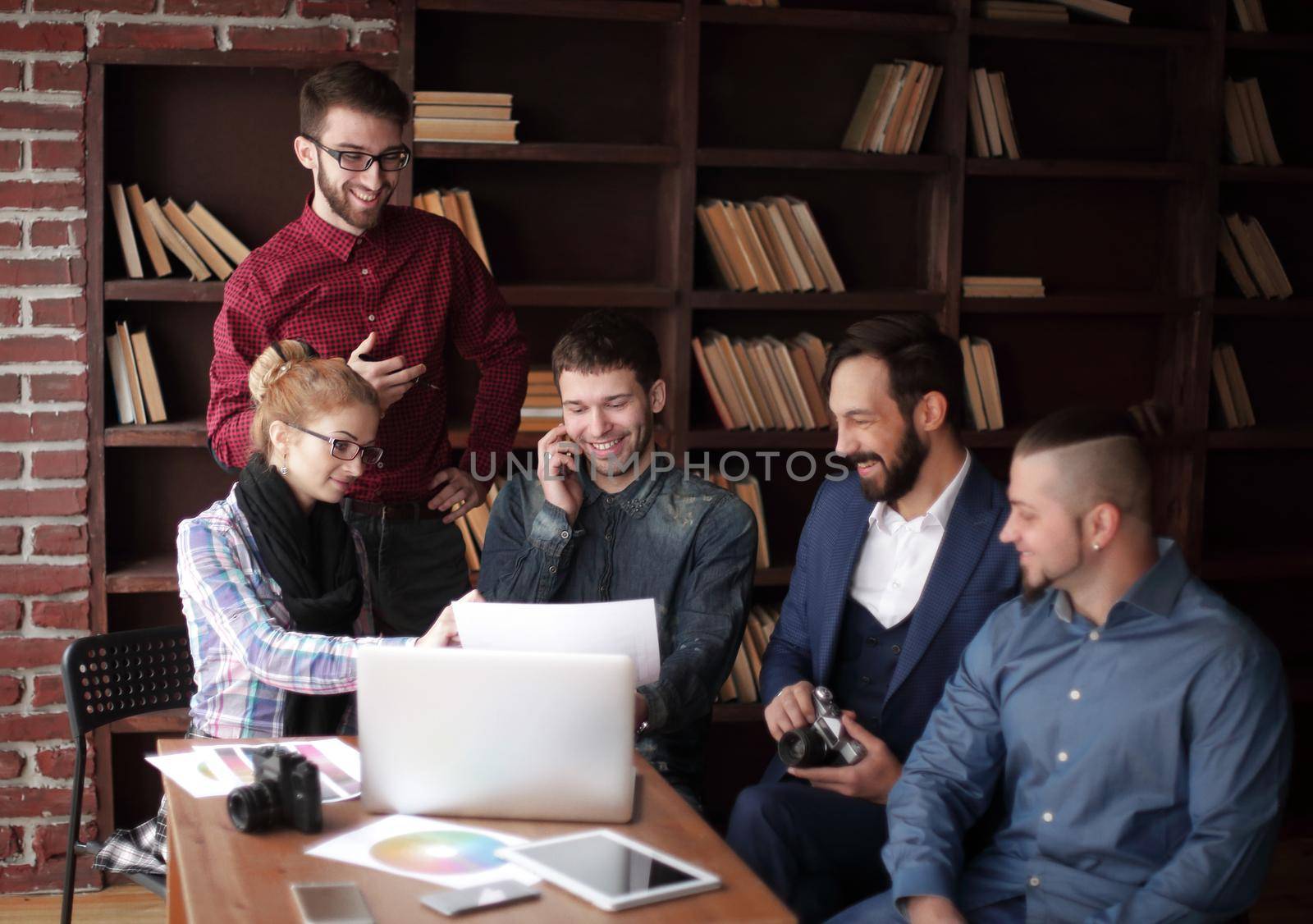 creative group of designers at a working meeting in the Studio. by SmartPhotoLab