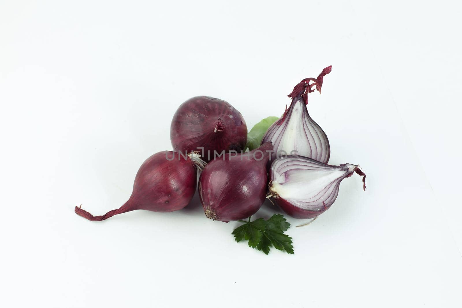 red onion and parsley leaves.isolated on a white background .photo with copy space