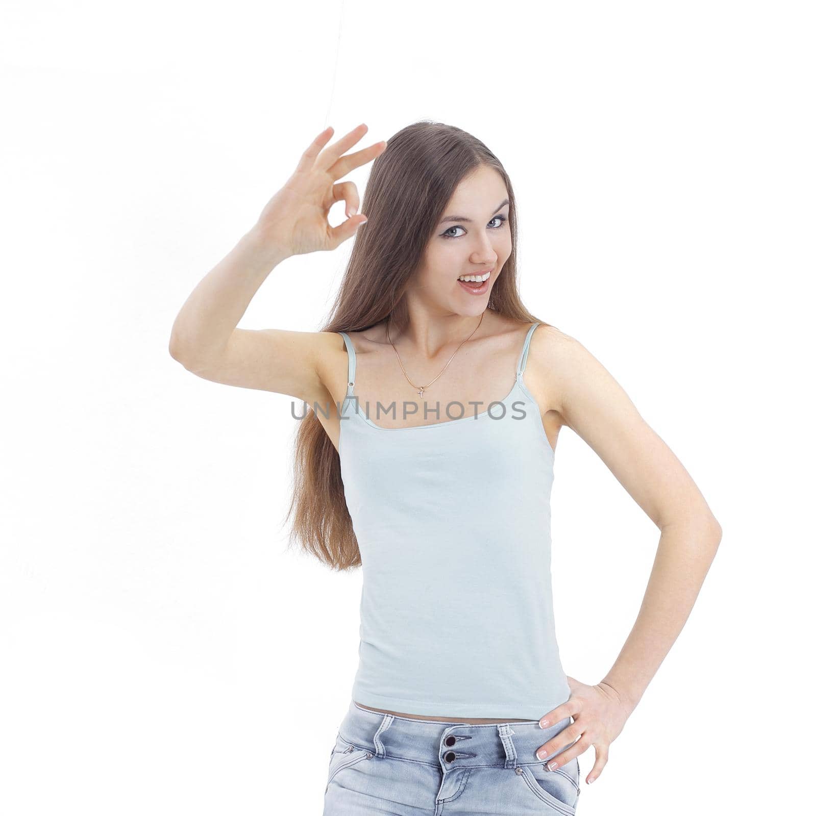 modern young woman showing the OK sign . isolated on a white background.photo with copy space