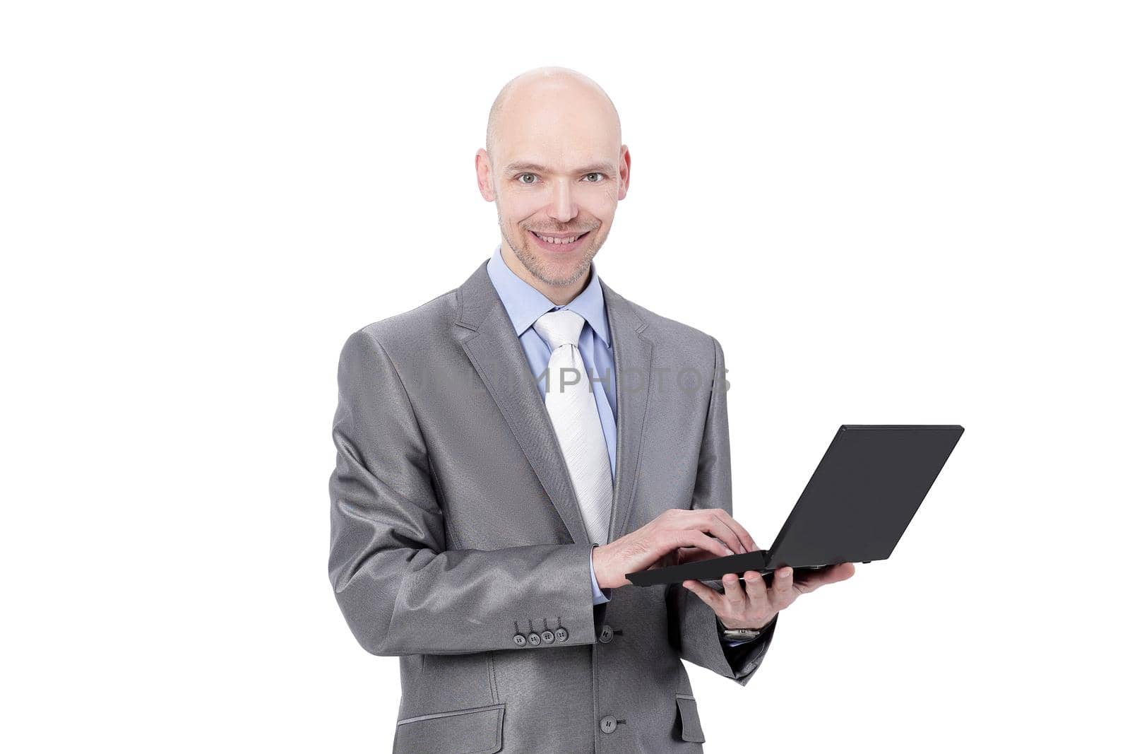 attentive businesswoman standing with a laptop.isolated on white background