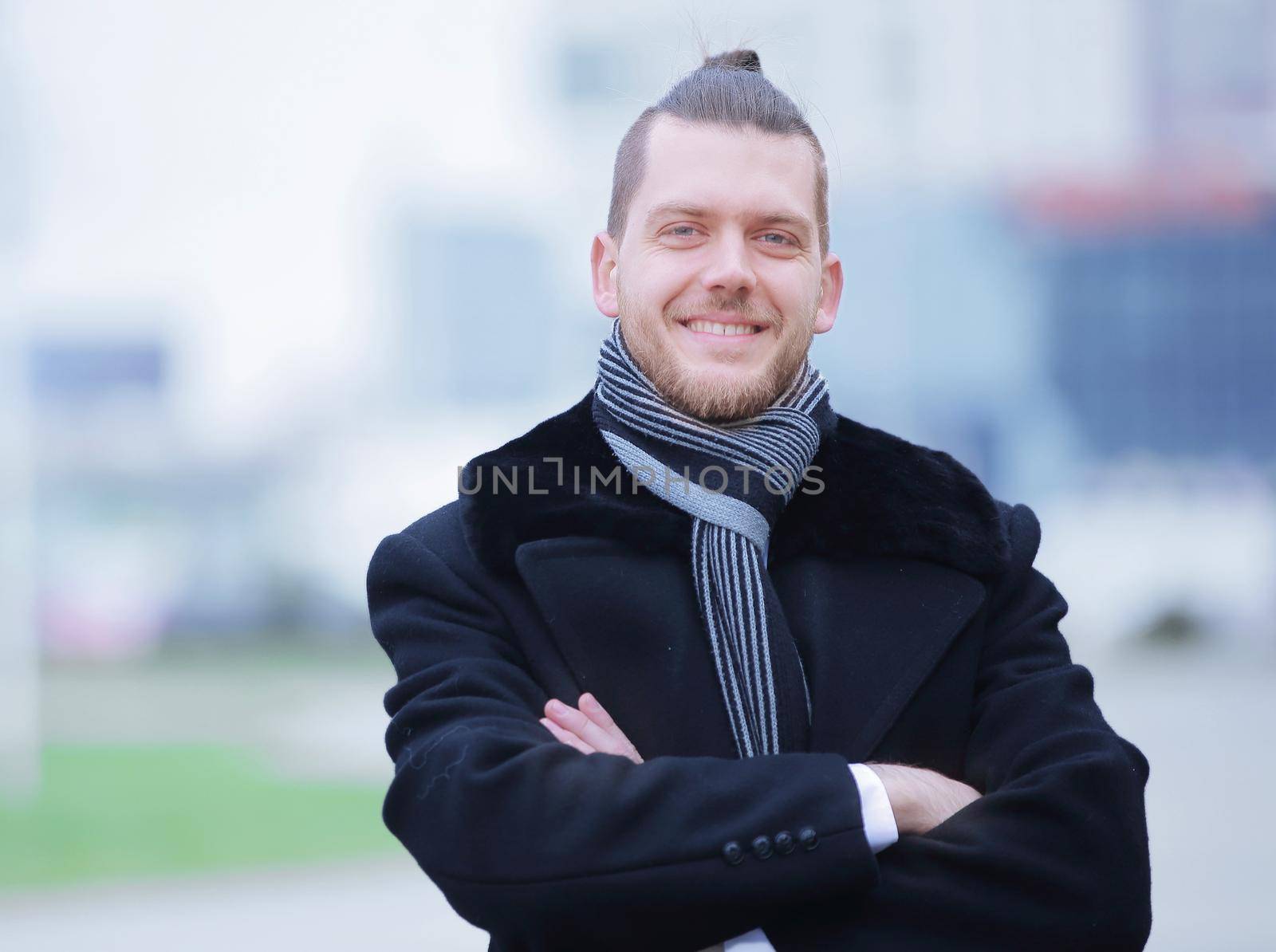 closeup.portrait of a successful man on blurred background city.