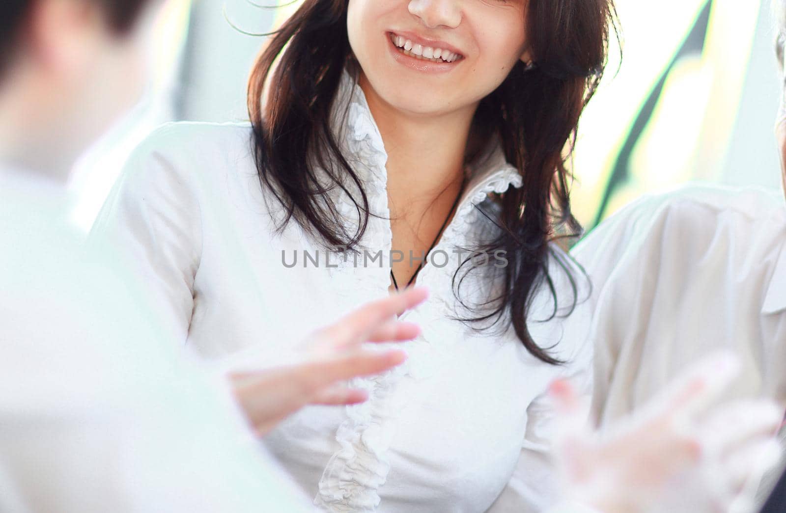 closeup. business team talking while sitting at your Desk in the office