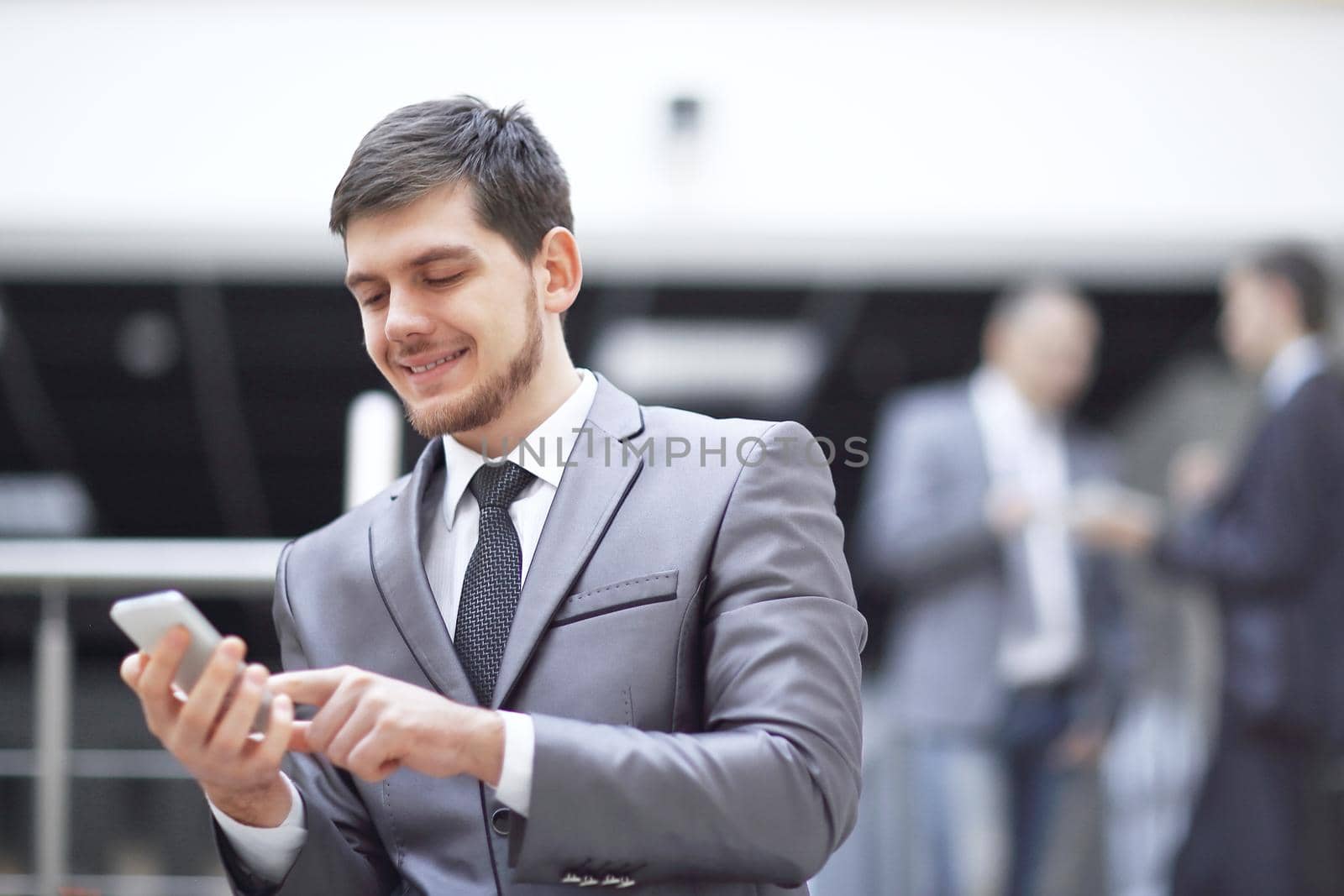 portrait of handsome businessman on blurred office background.photo with copy space