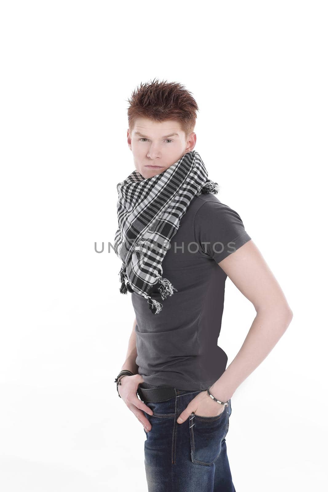 side view.stylish modern guy with the scarf.isolated on a white background.