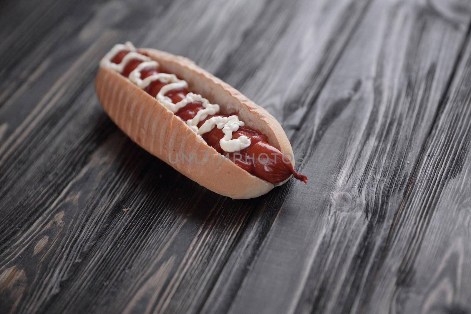 hot dog on wooden background.photo with copy space by SmartPhotoLab