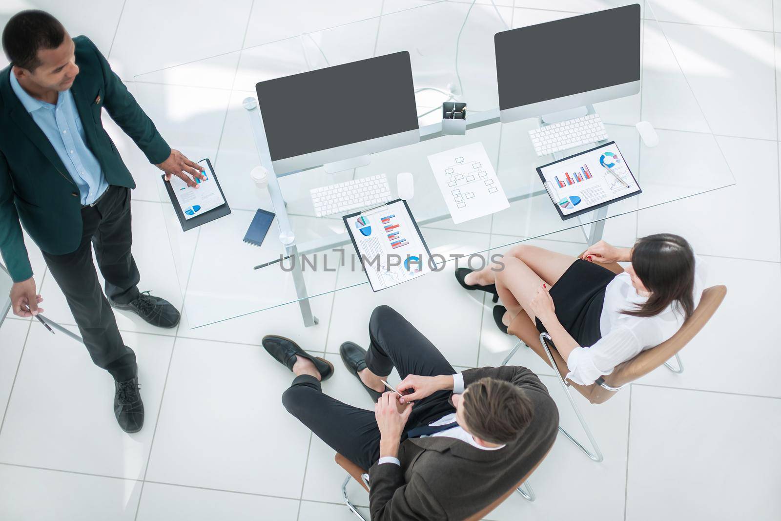 view from the top.business team in a modern office. by SmartPhotoLab