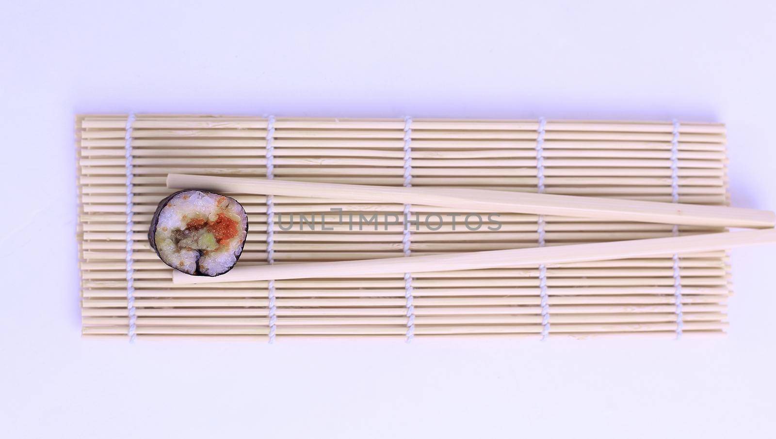 large sushi and chopsticks .isolated on a light background.photo with copy space