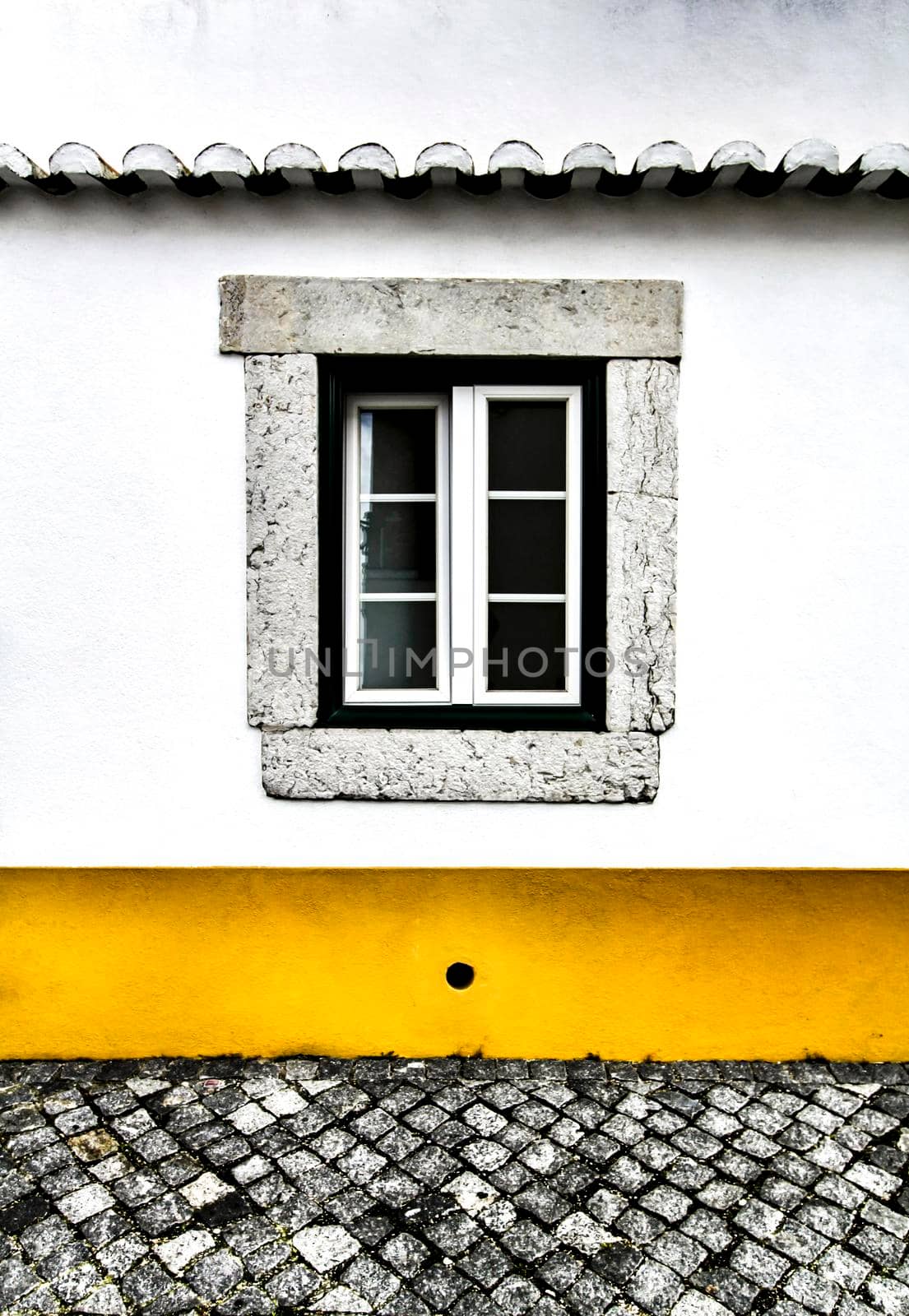 Typical vintage portuguese facade with old window by soniabonet