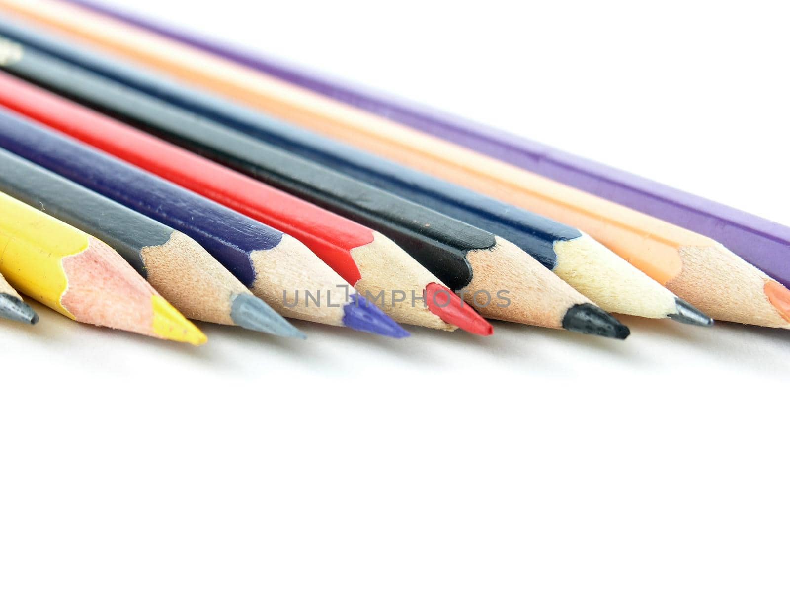 set of colored pencils on white background.photo with copy space by SmartPhotoLab