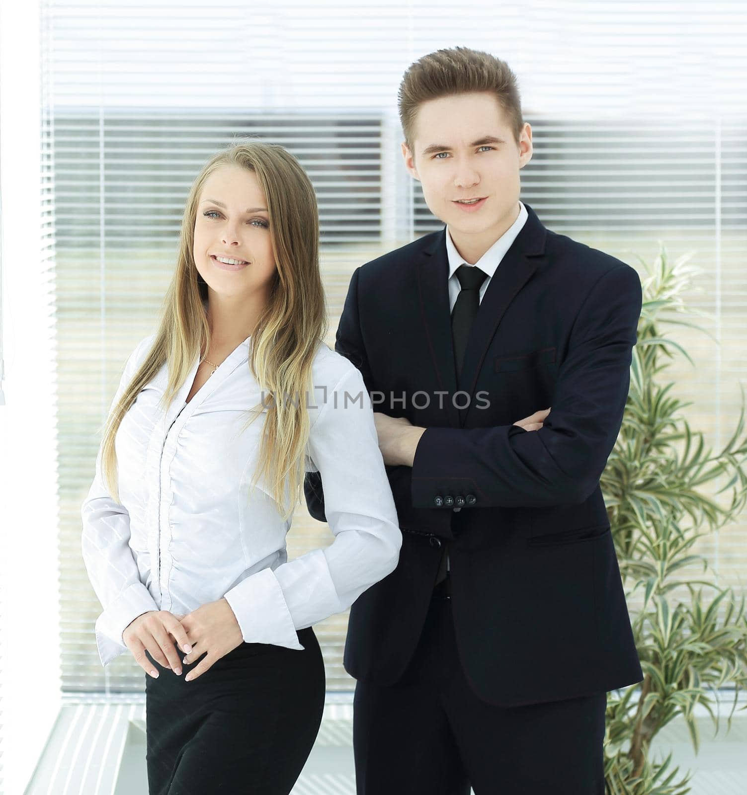 business couple standing in a modern office.photo with copy space