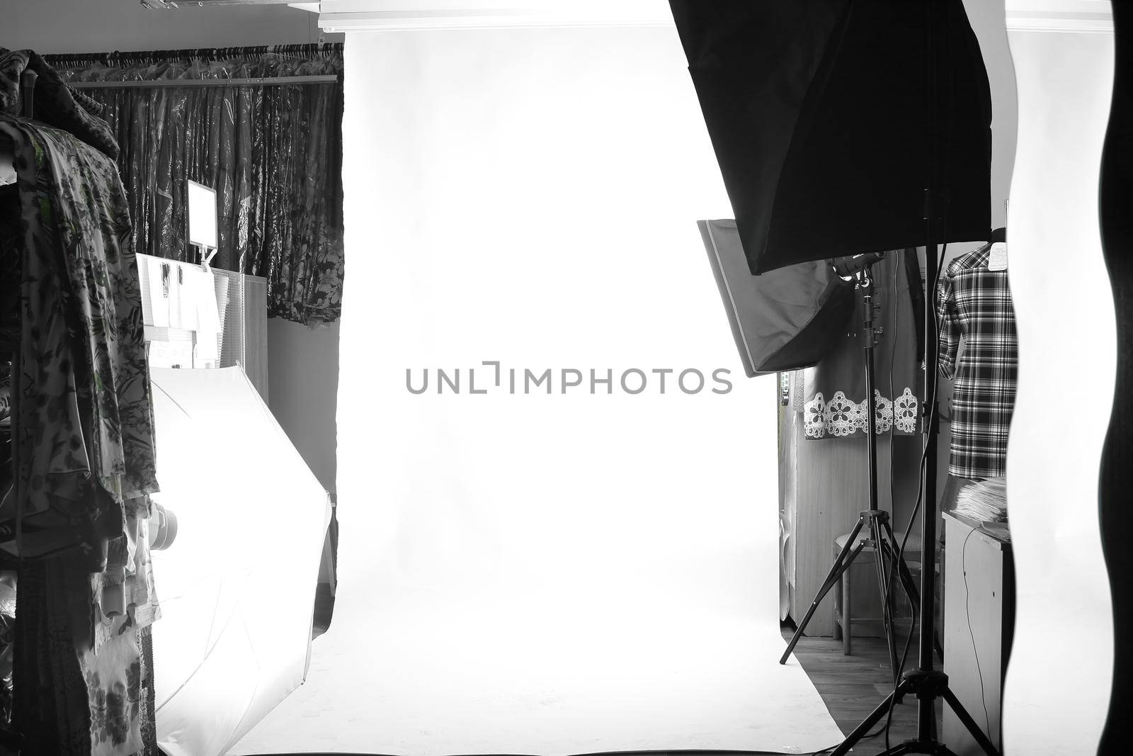 background image of Empty photo Studio with lighting equipment.