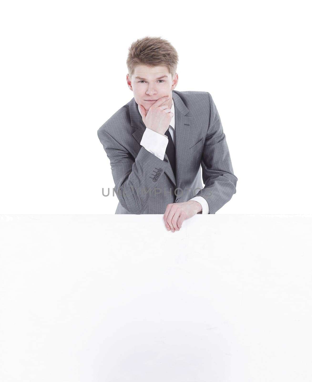 successful young businessman with blank banner.isolated on a white background
