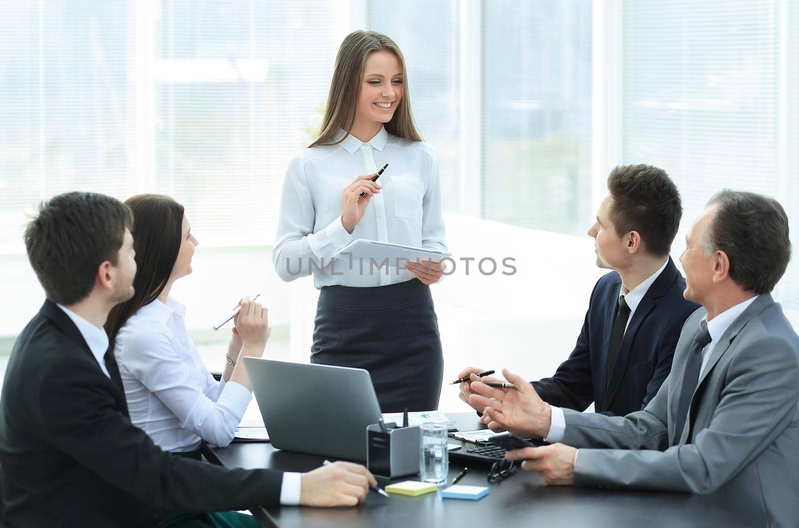 young business woman makes a report on the working meeting in the office.photo with copy space