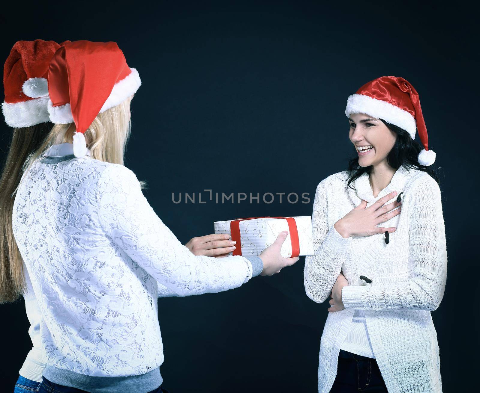 happy young girl in costume of Santa Claus with Christmas gifts. isolated on black.photo with copy space.