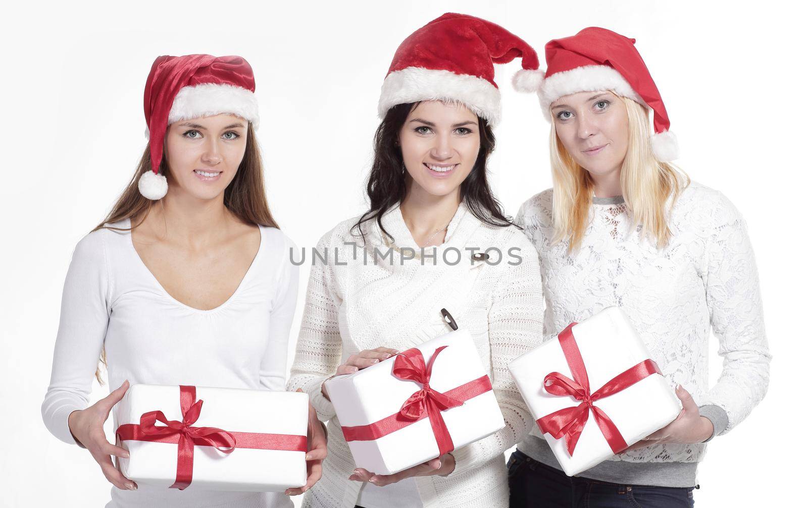 group of female students in costume of Santa Claus with Christmas gifts .photo with copy space.