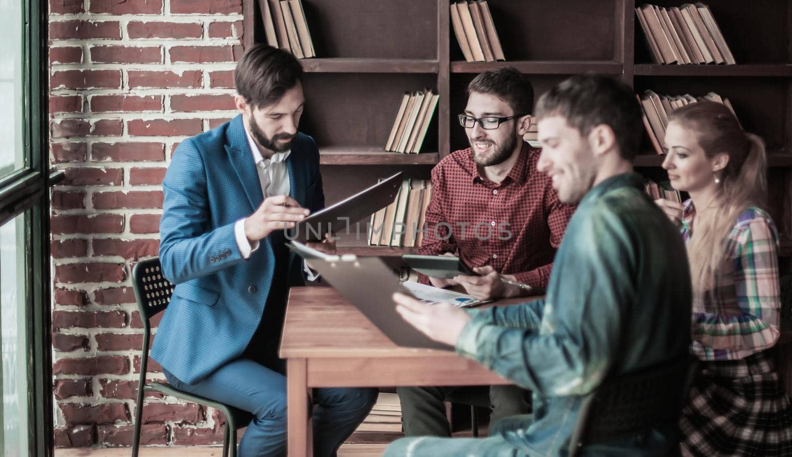 successful business team discussing a financial report on the company's profits in the workplace in the office