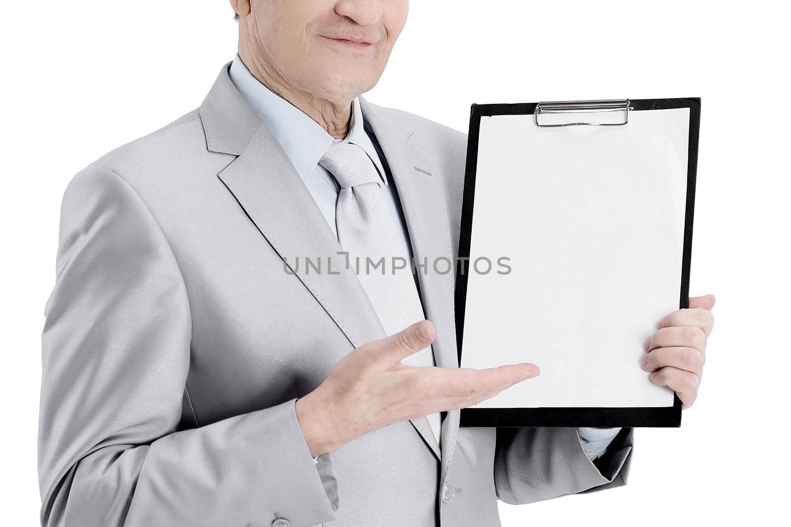 Mature businessman pointing at blank sheet.isolated on a white background