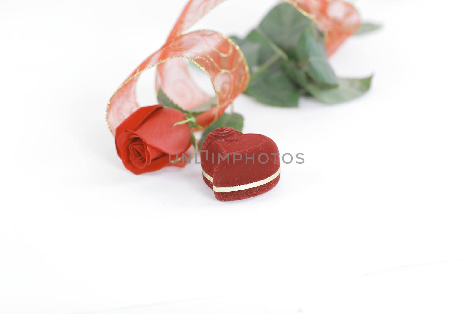 red rose and box with ring on white background.photo with copy space by SmartPhotoLab