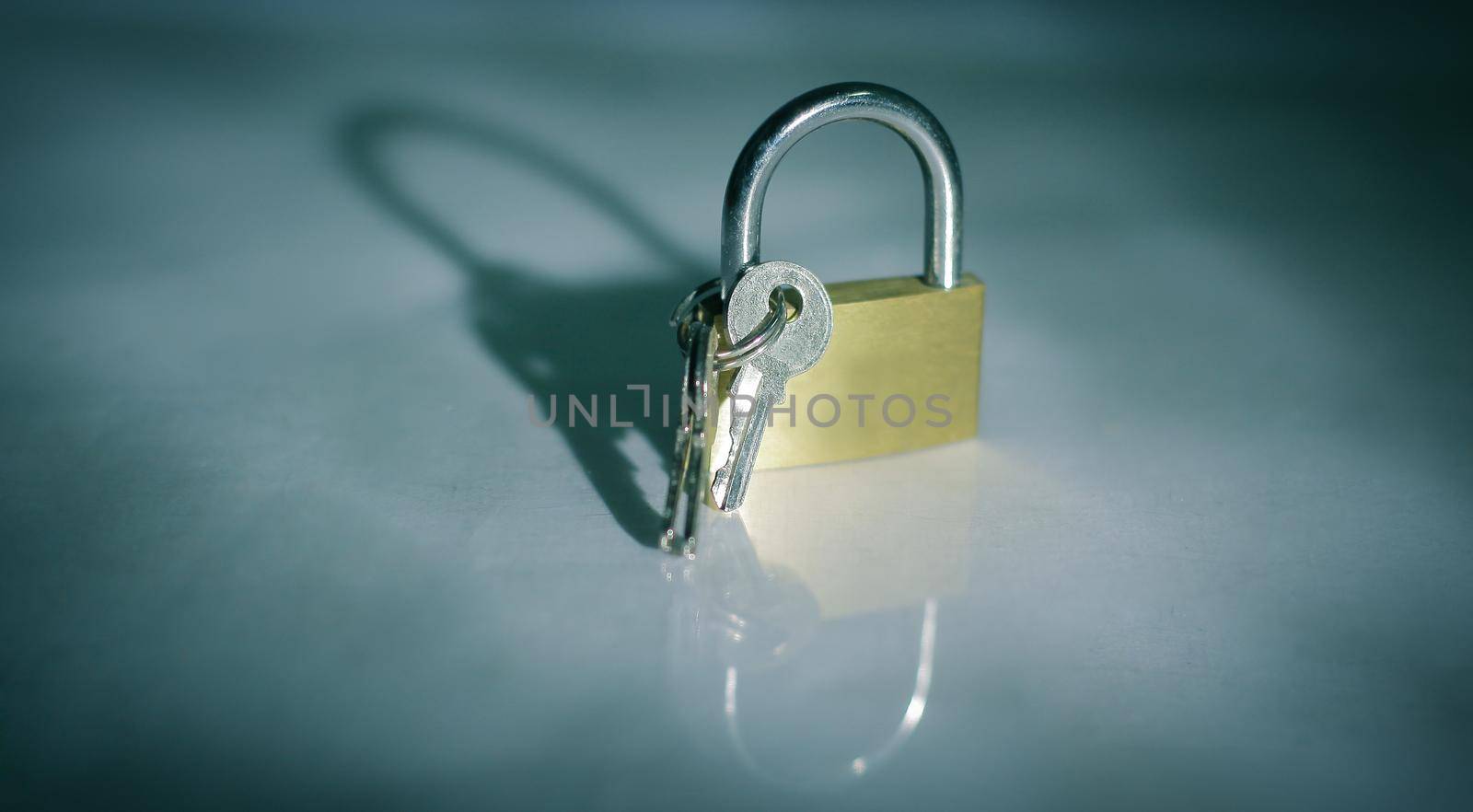 lock and key.isolated on a dark background by SmartPhotoLab