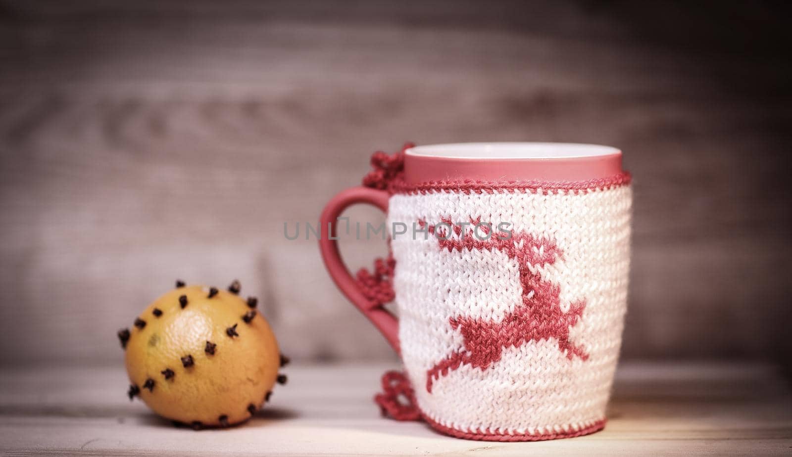 decorative Christmas Cup and orange on wooden background.photo with copy space