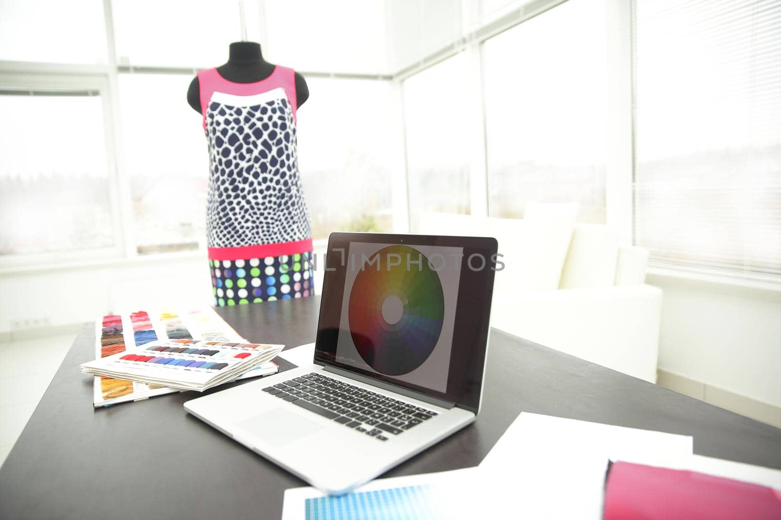 laptop and tissue samples on the desktop of the designer.photo with copy space