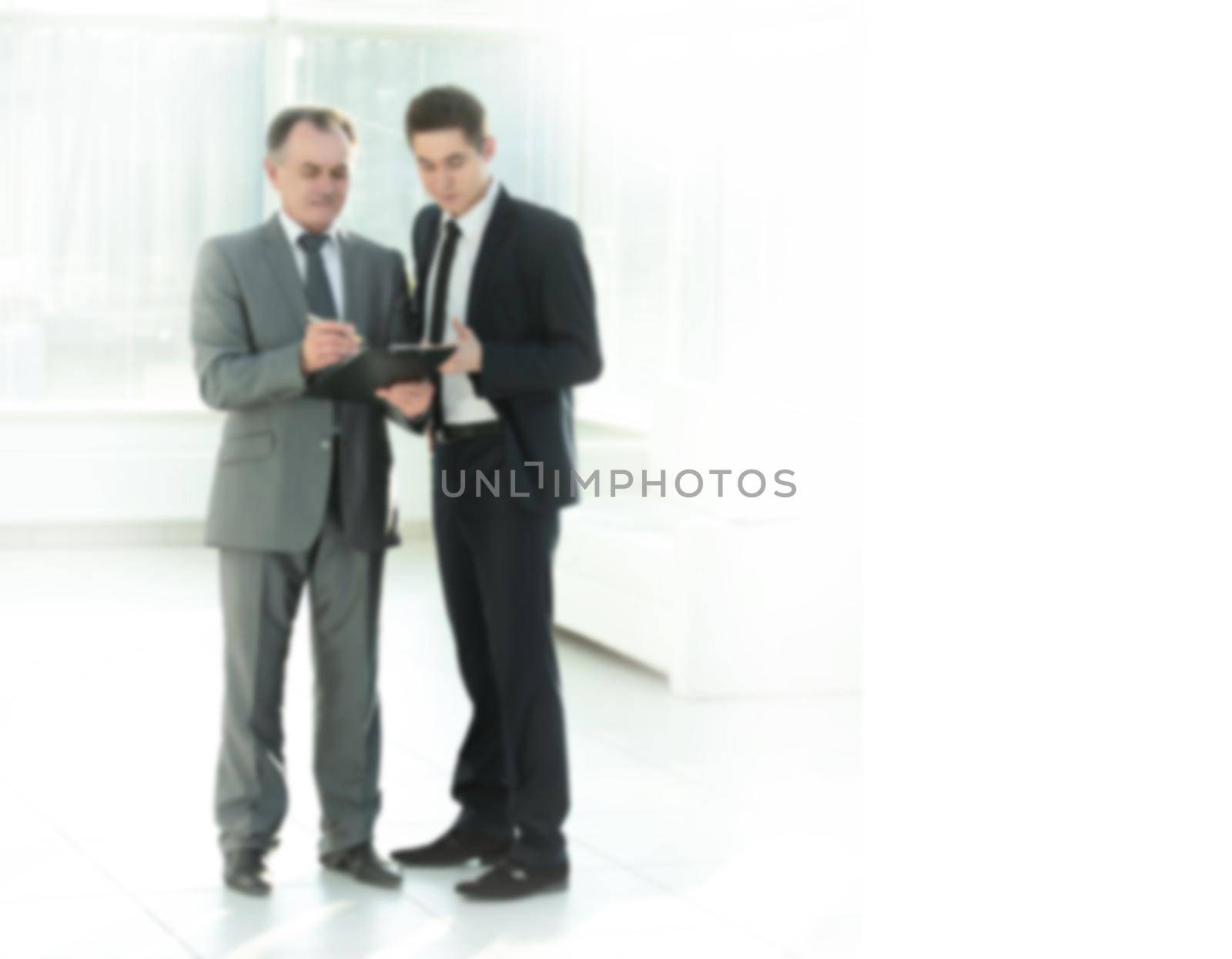 Businessman showing a document to his colleague.photo with copy space