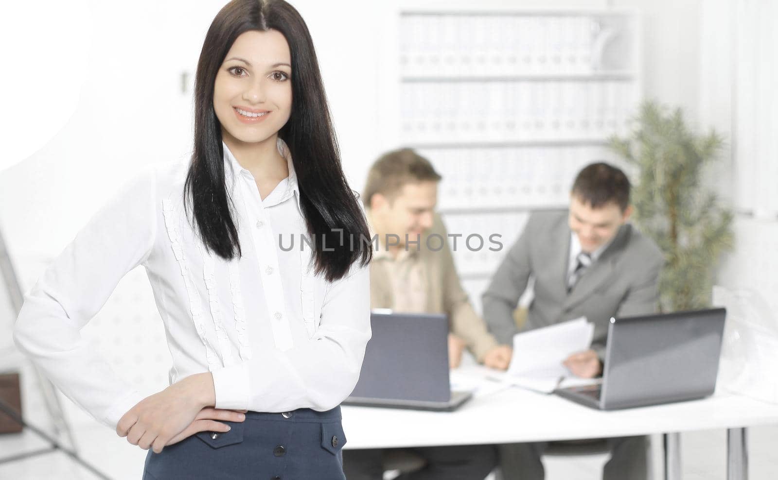 woman Manager on the background of the office by SmartPhotoLab