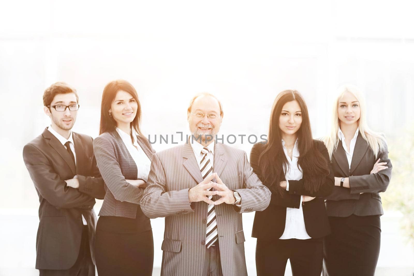 Portrait of an handsome businessman in front of his working team.photo with copy space