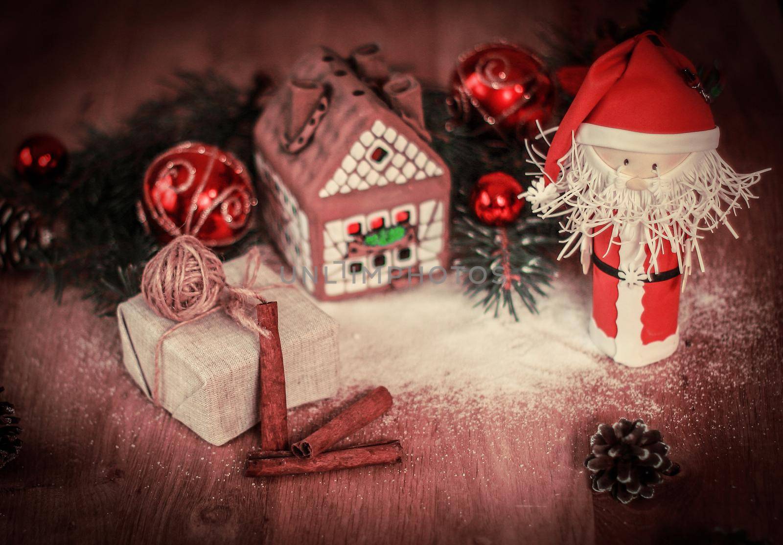 Christmas present on the background of a gingerbread house.photo with copy space