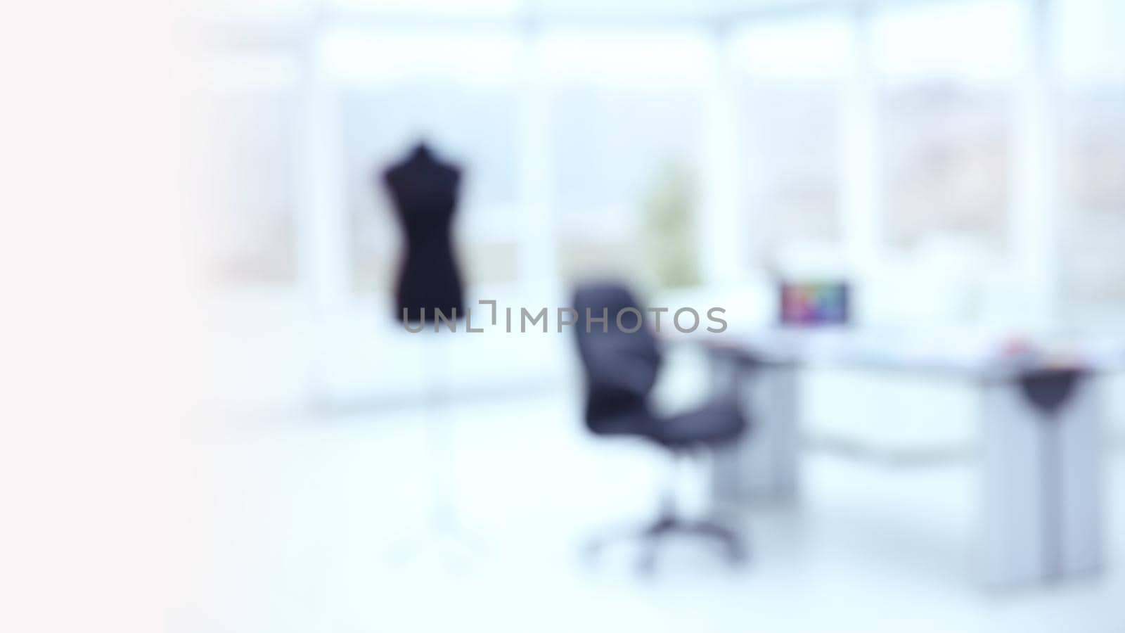 blurred image of an office in the Atelier fashion . individual tailoring .photo with copy space