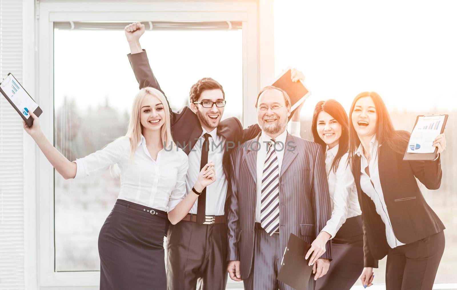 leader and successful business team cheering after signing a lucrative financial contract.