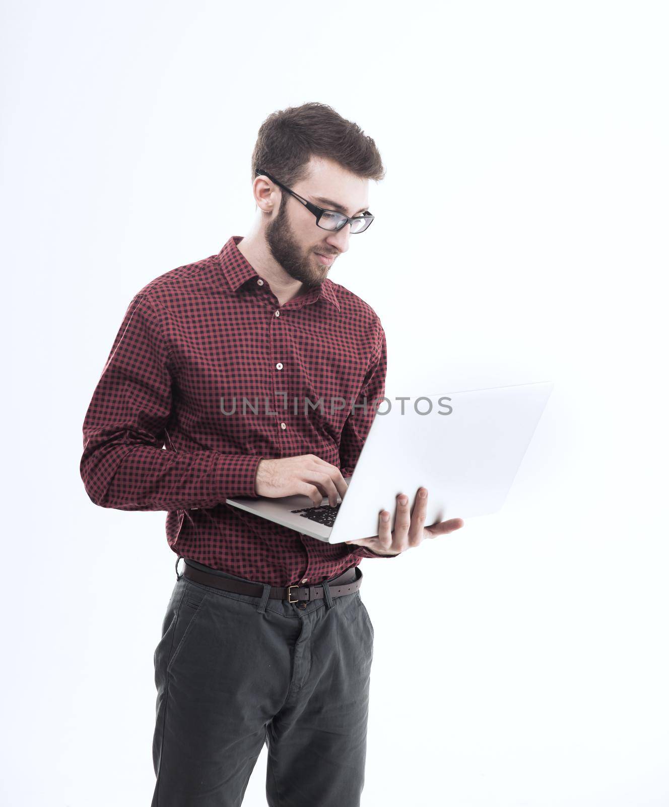 system administrator with a laptop against white background.the photo has a empty space for your text