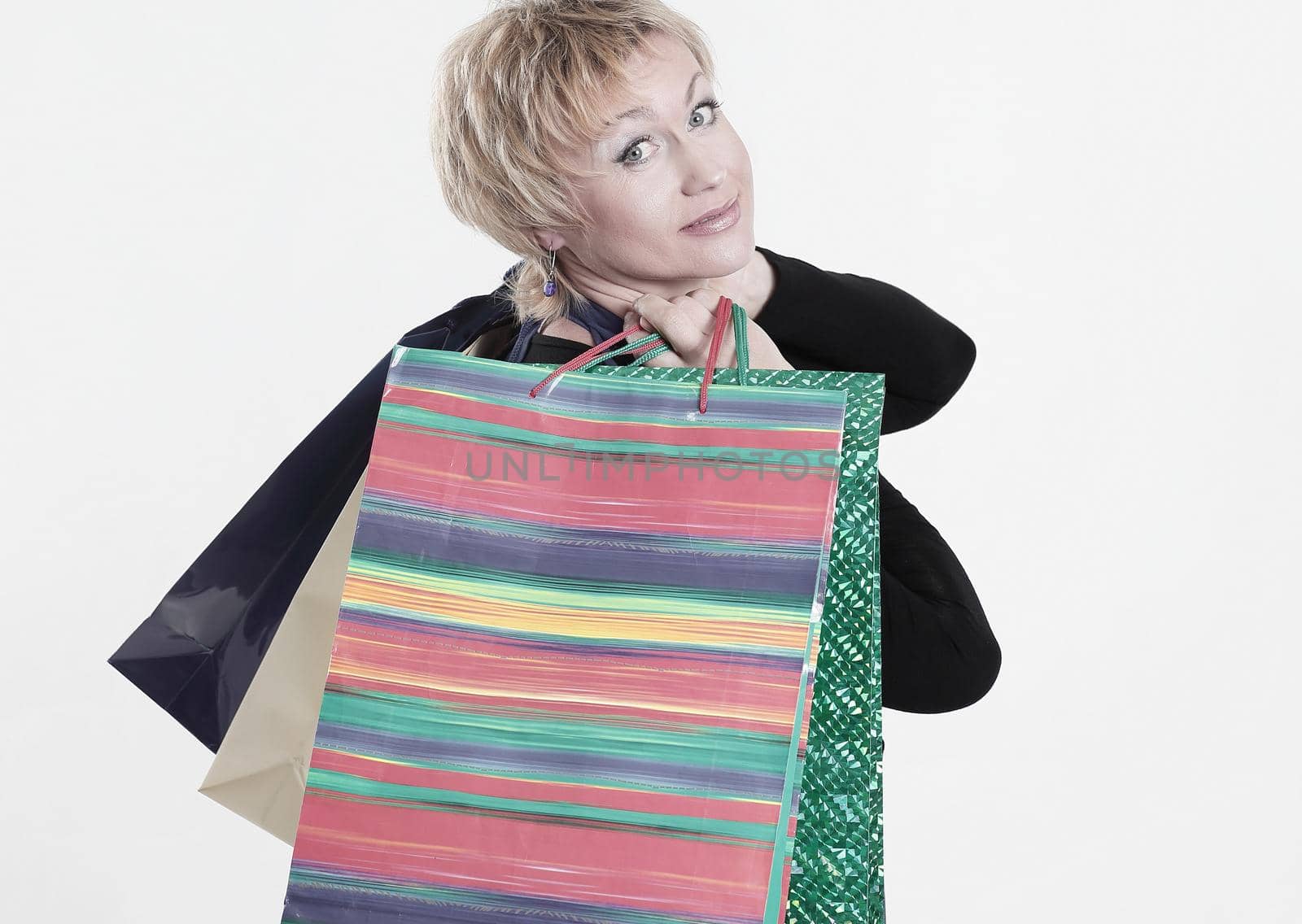 beautiful woman with shopping bags .isolated on gray background.photo with copy space