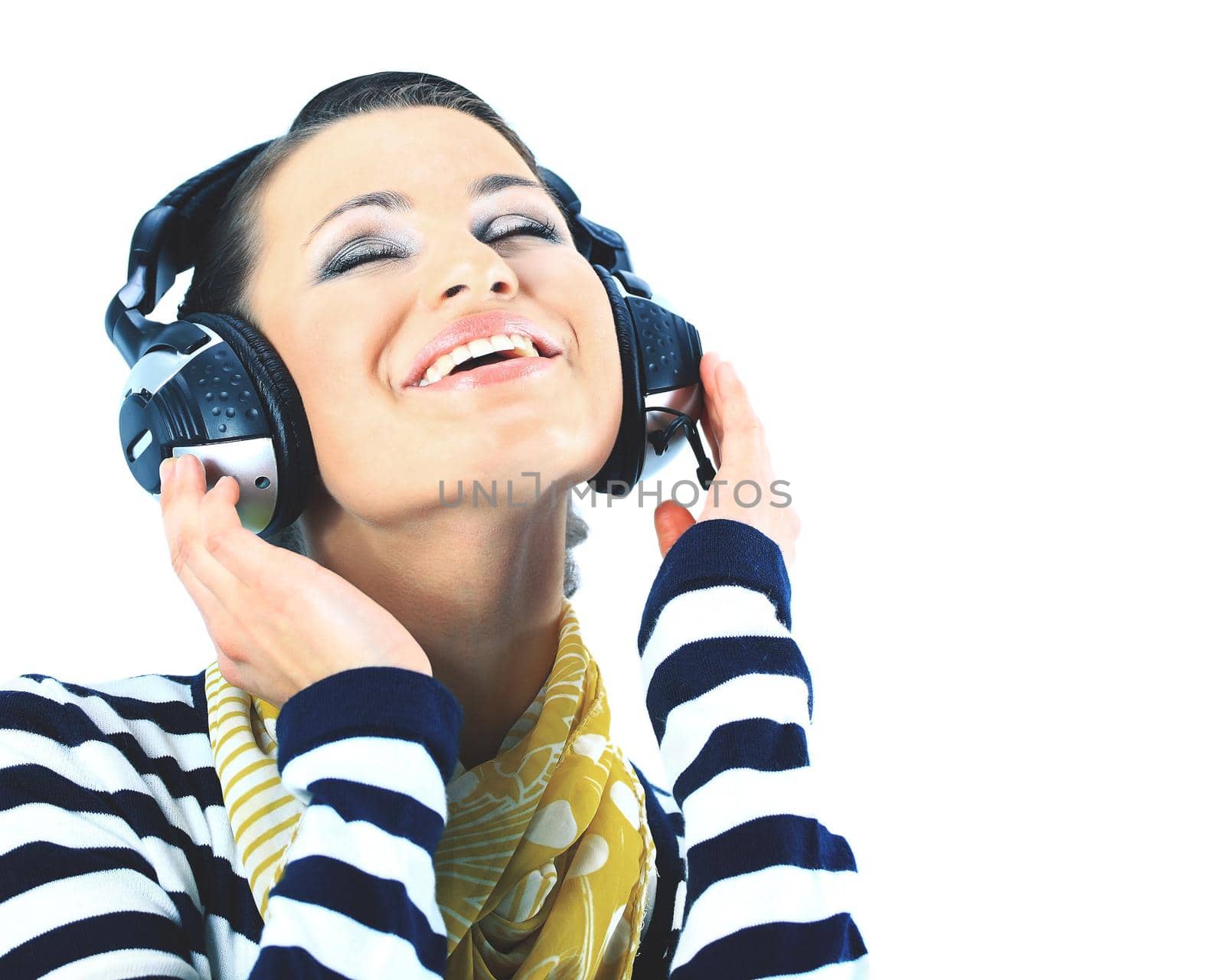 Beautiful girl with headphones. Isolated on a white background