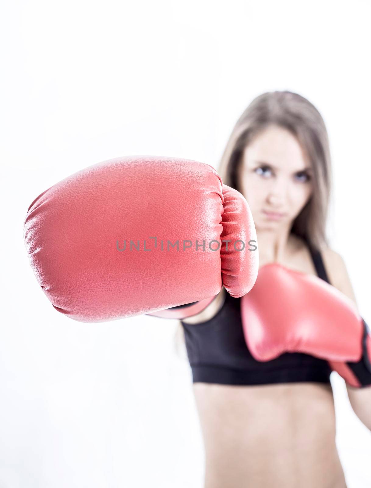 sporty woman in red Boxing gloves.a healthy way of life.beauty and sport.the photo has a blank for text