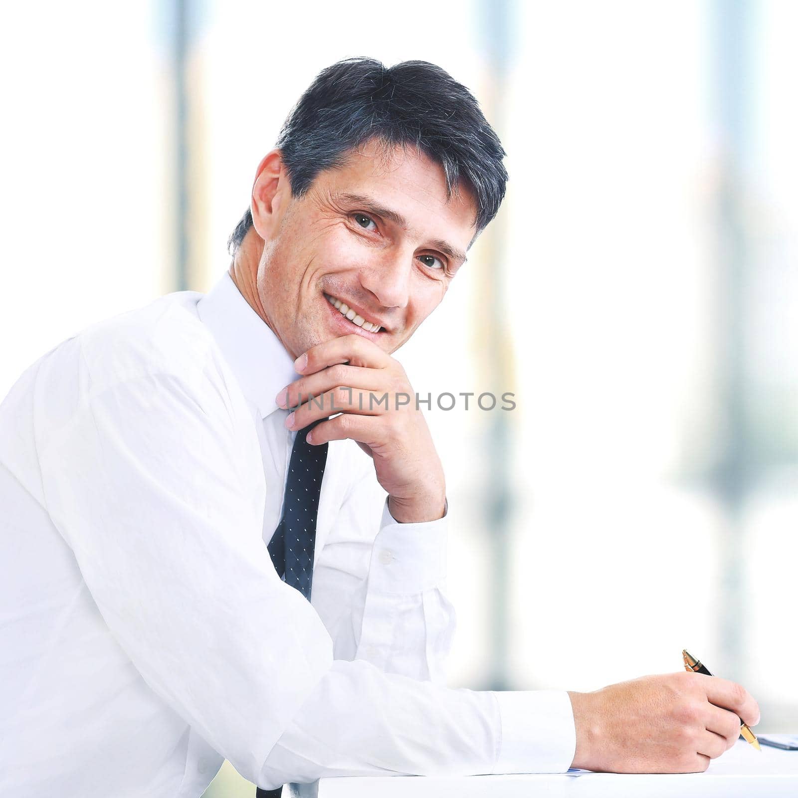 Handsome business man smiling at the office by SmartPhotoLab