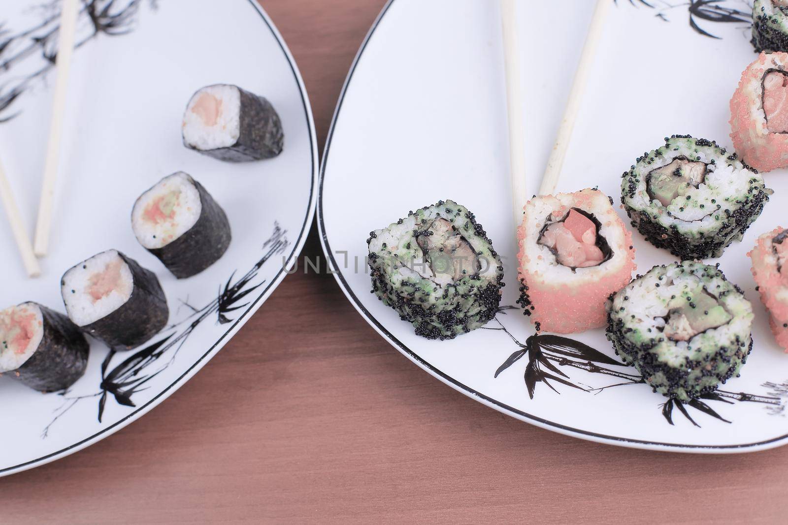 Roll of sushi prepared from raw fish and a special rice by SmartPhotoLab