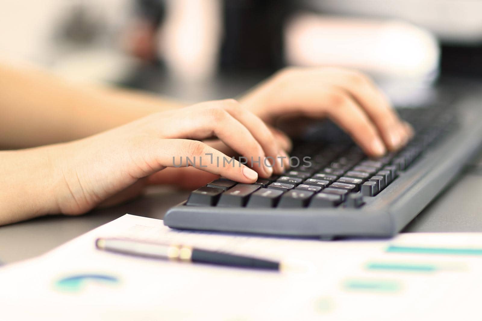 Close-up shot of a female learner typing on the keyboard