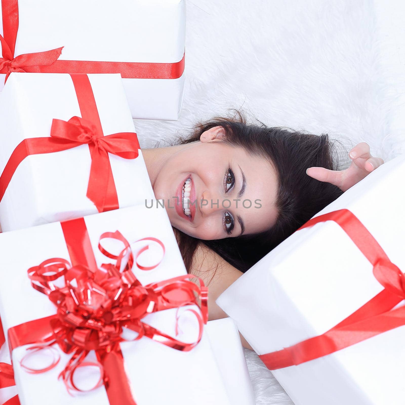 closeup. enthusiastic beautiful woman with her gift. by SmartPhotoLab