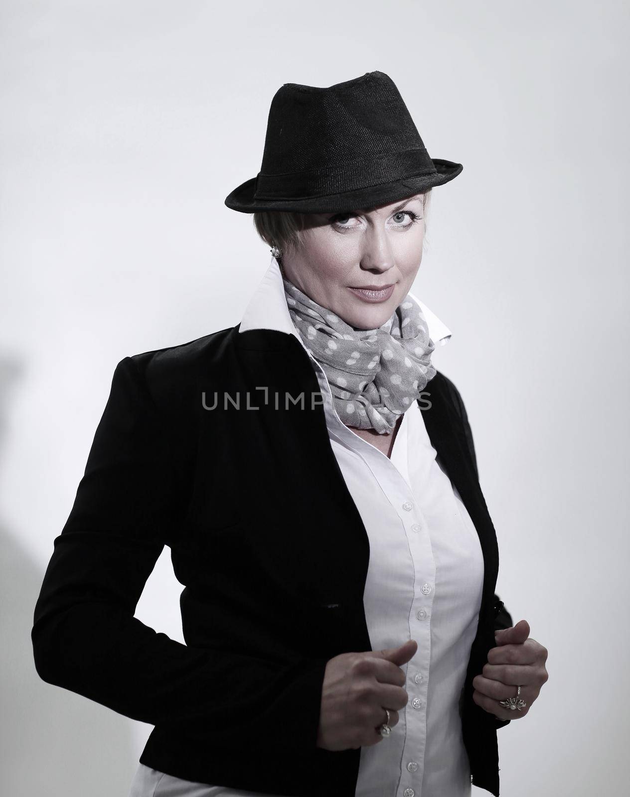 portrait of glamorous woman in a black hat .isolated on gray background.