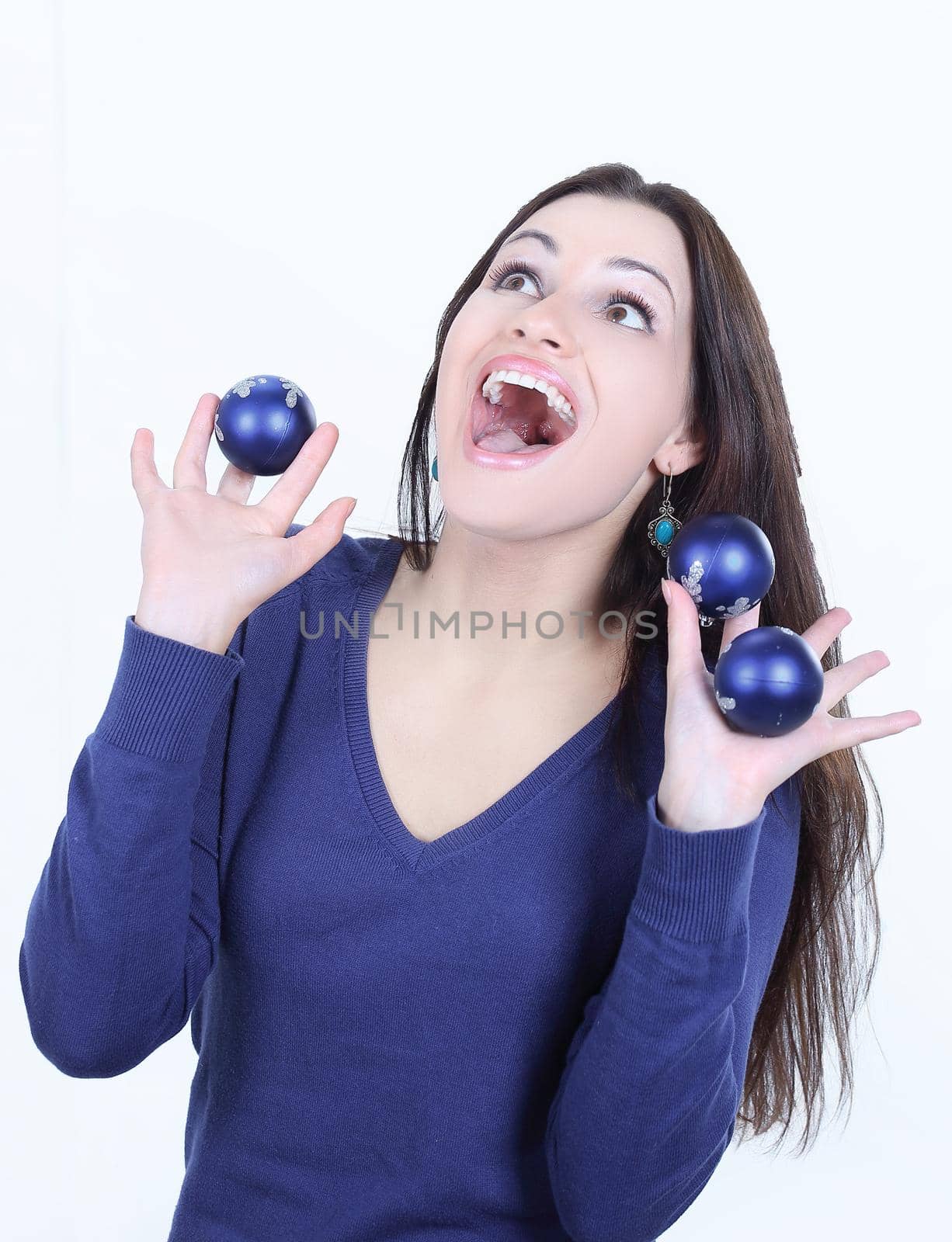 happy beautiful young woman holding Christmas balls.isolated on white background