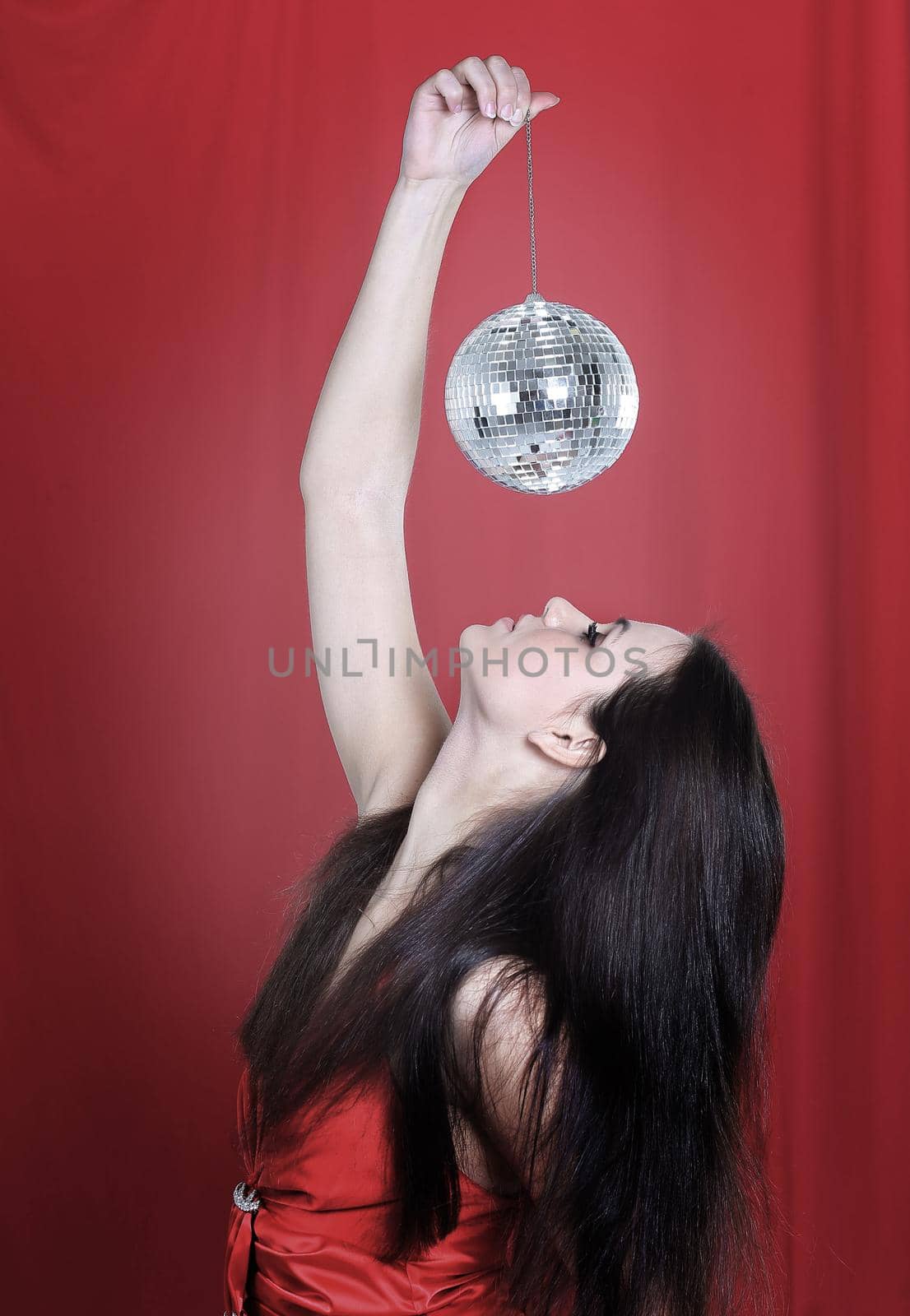 stylish young woman with a mirror ball .photo with copy space
