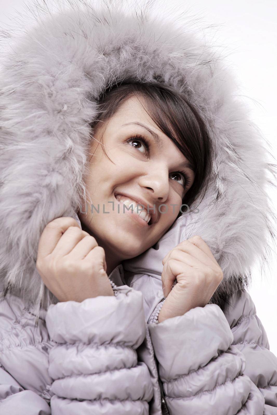 portrait of beautiful young woman in winter jacket by SmartPhotoLab