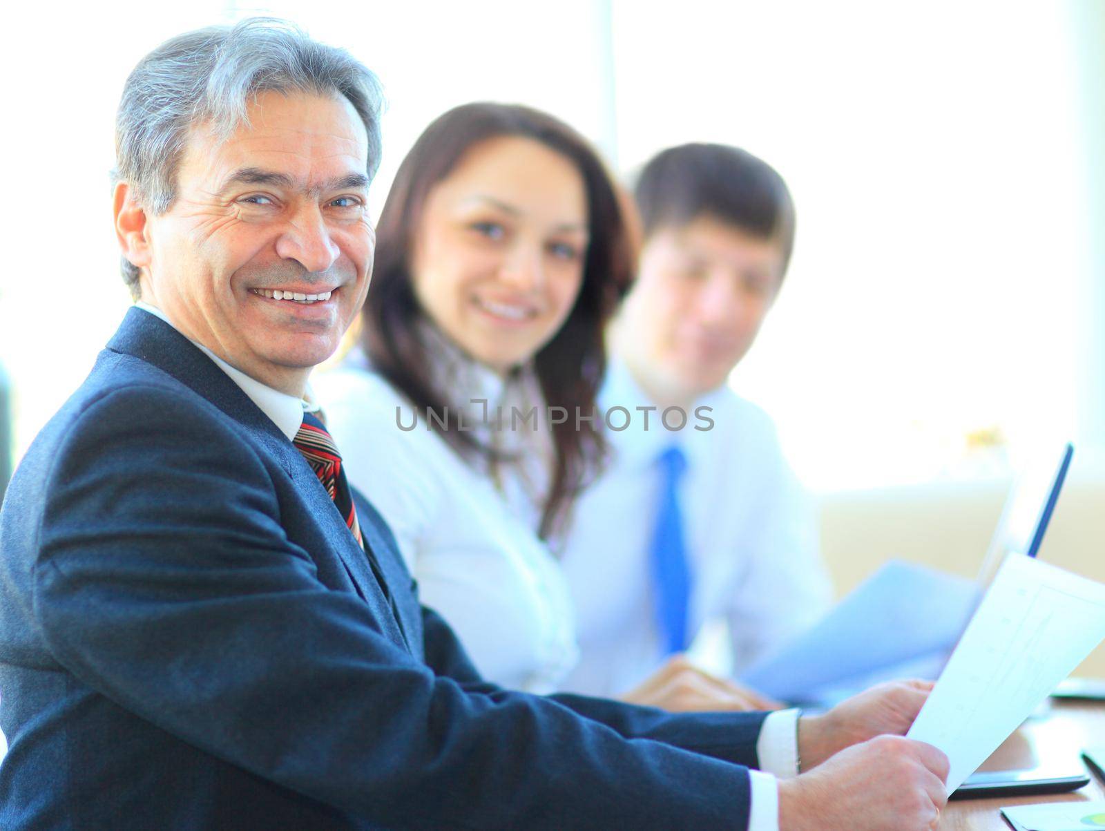 Happy business man with colleagues by SmartPhotoLab