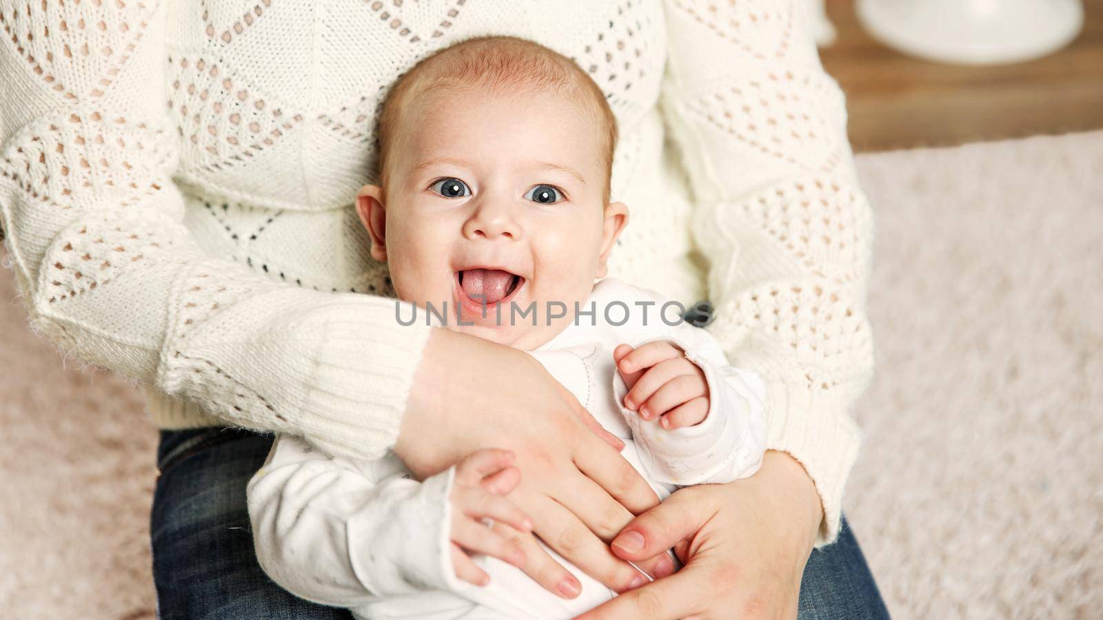 small child in the arms of mom . positive human emotions