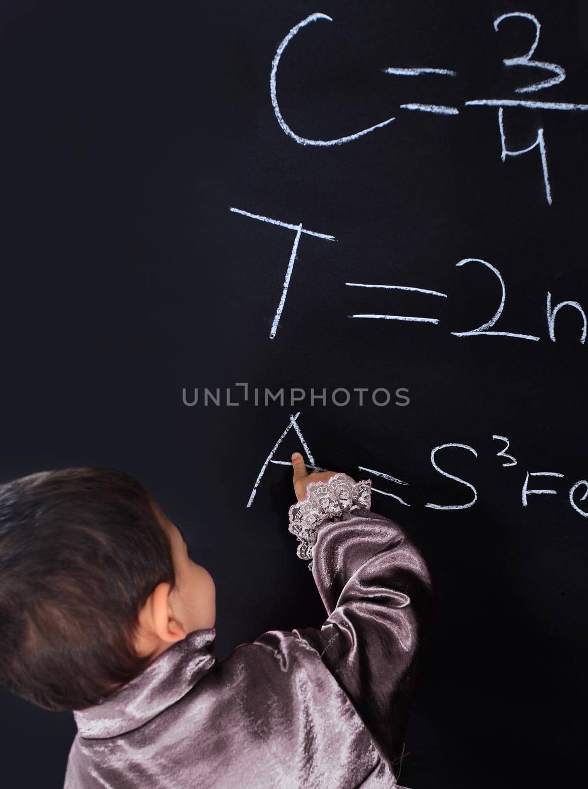 little Gypsy boy in national costume standing near school blackboard by SmartPhotoLab