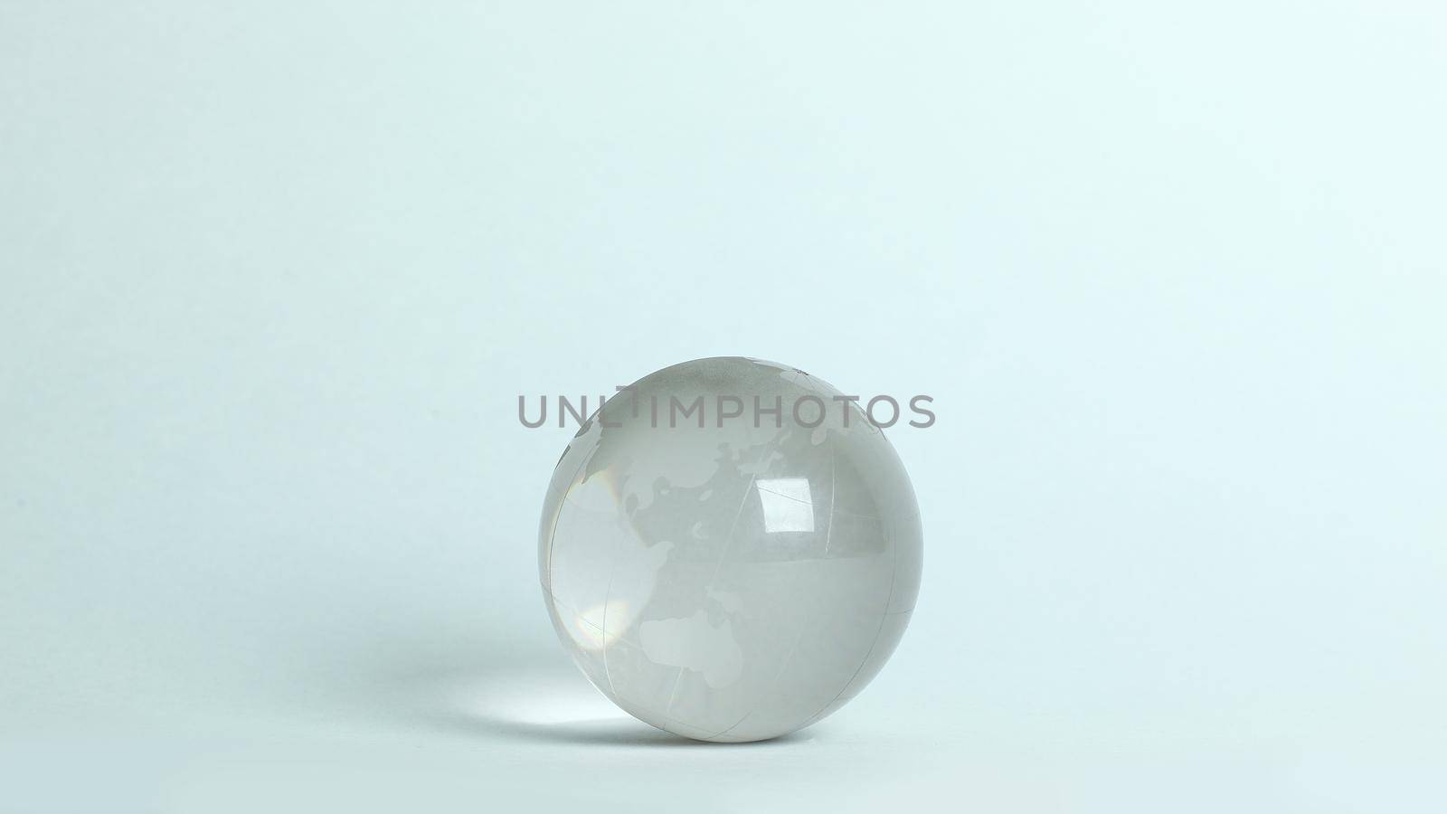 small glass globe.isolated on a white background.photo with copy space