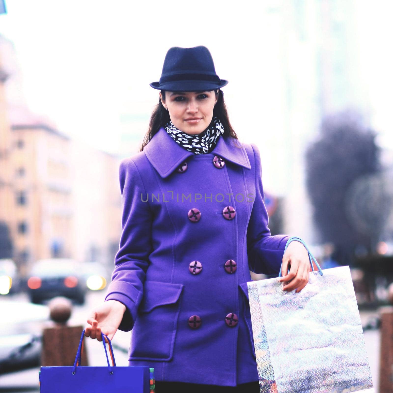 Beautiful girl walking down autumn street.